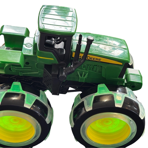 Other - John Deere tractor with light up wheels. Like new condition.​